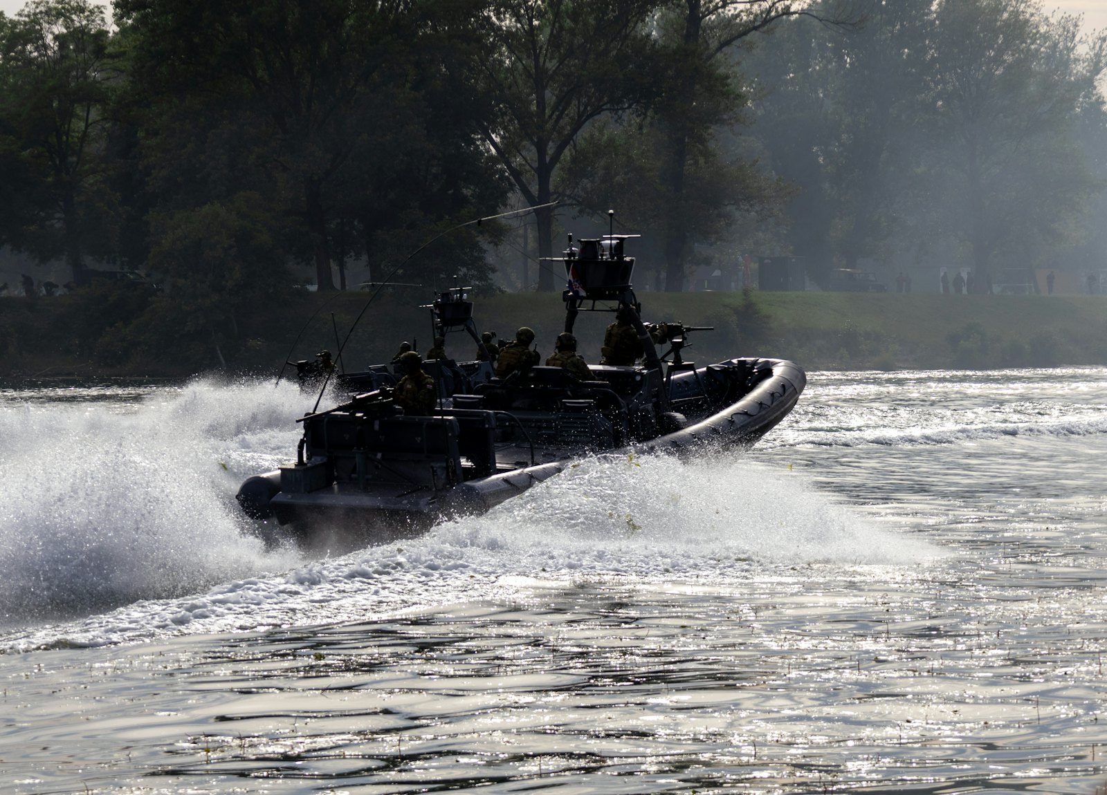 A navy boat at speed